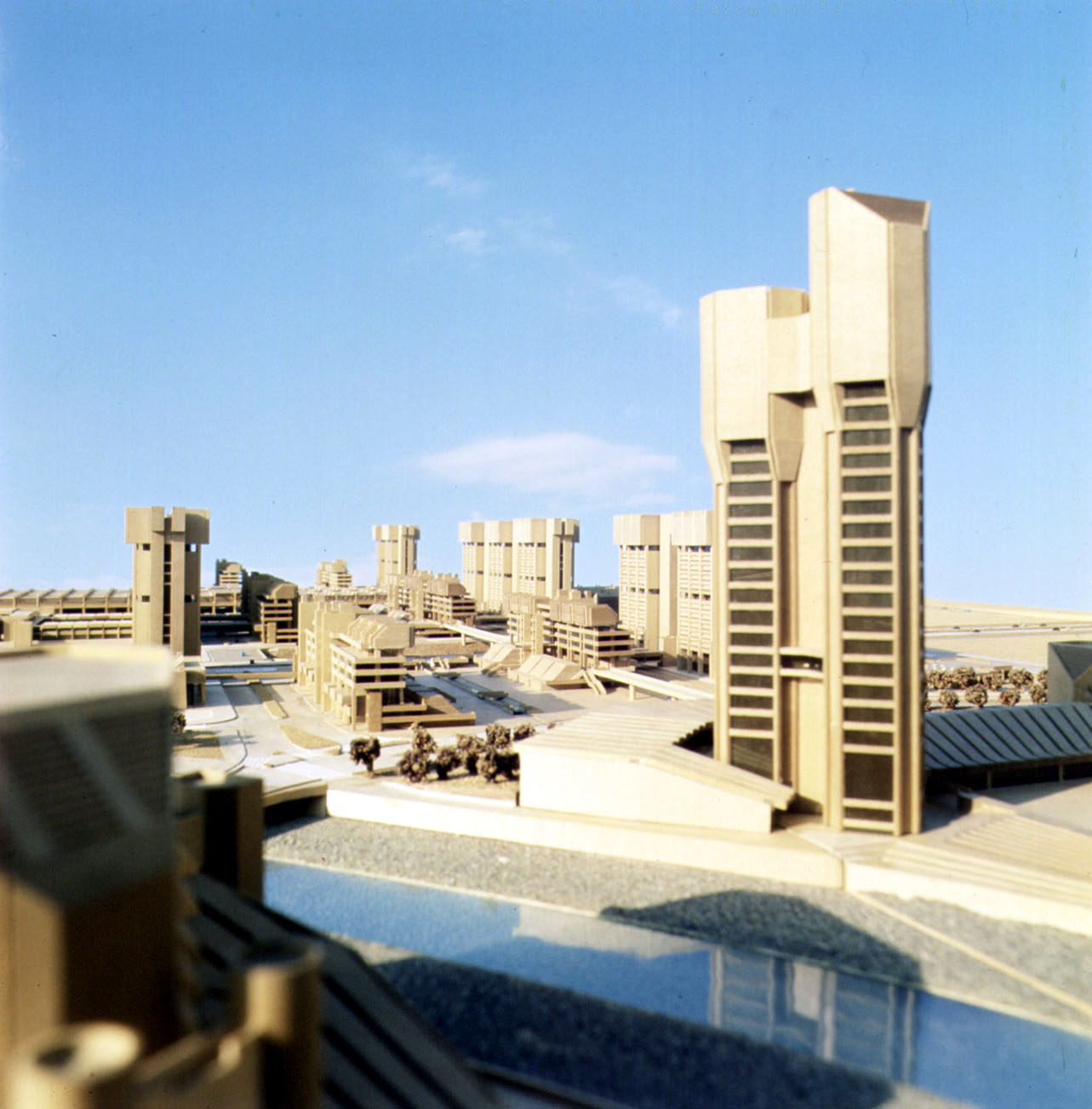 Color model view of Kenzo Tange's Skopje master plan with towers and the river foreground.